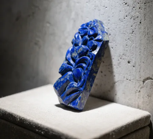 Close-up of polished lapis lazuli exhibiting pyrite flecks and calcite veining